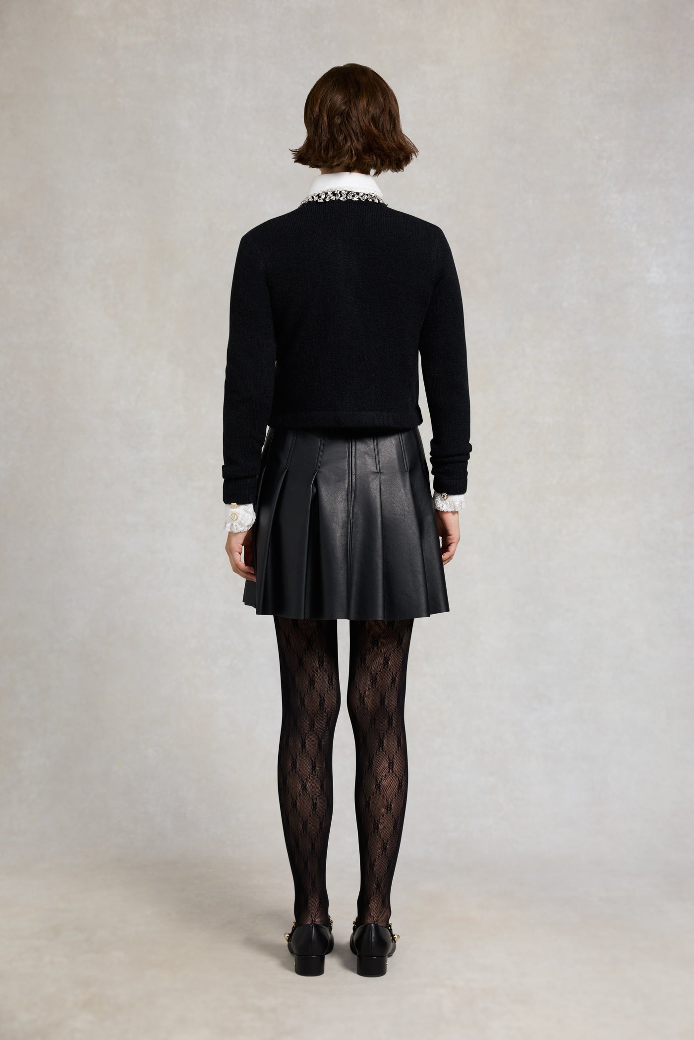 Holland Cooper Faux Leather Pleated Mini Skirt in Black Model Back